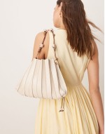 pleat detail shoulder bag with resin ball and knot strap detail in cream